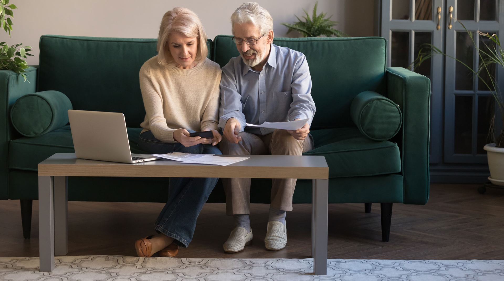 An elderly couple organizing finances